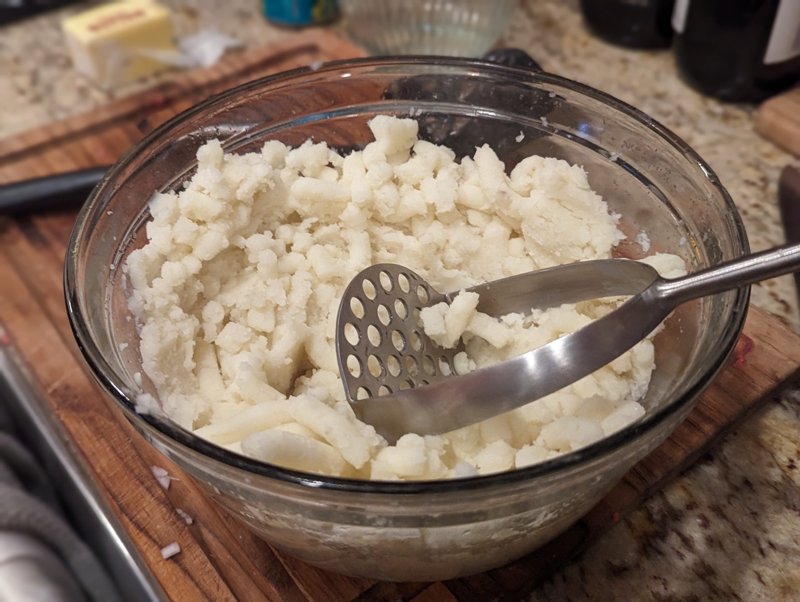 A dish of Mashed Potatoes in a glass bowl